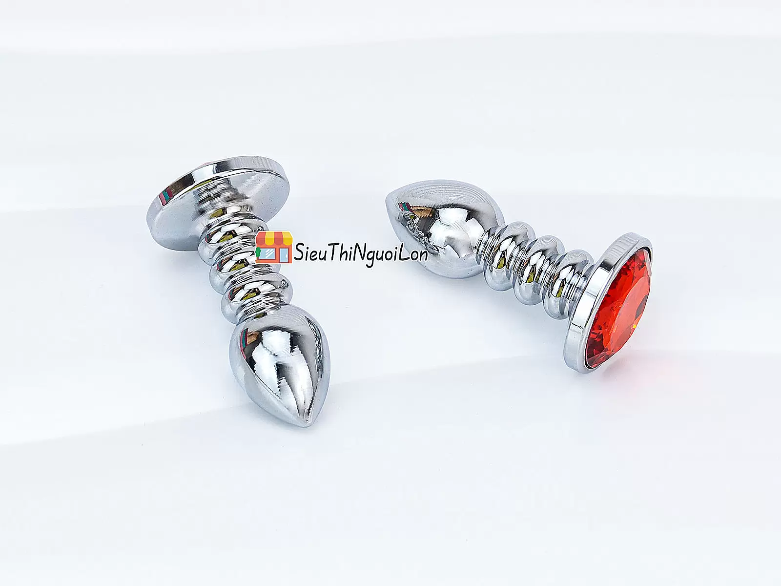 Đồ chơi kích hậu Inox xoắn ốc đuôi pha lê màu cam